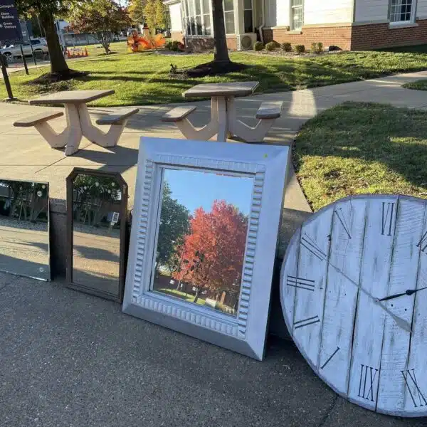 A mirror and clock for sale at the Yard Sale.