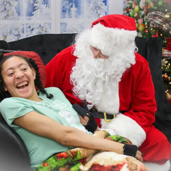 A young woman with Santa Claus.