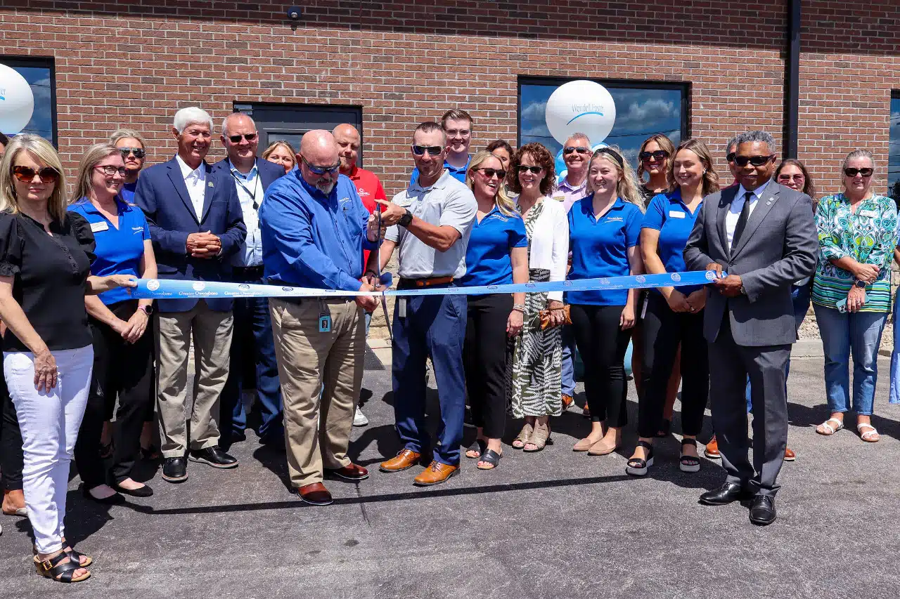 Cutting the ribbon to officially open the Aquatic Center.